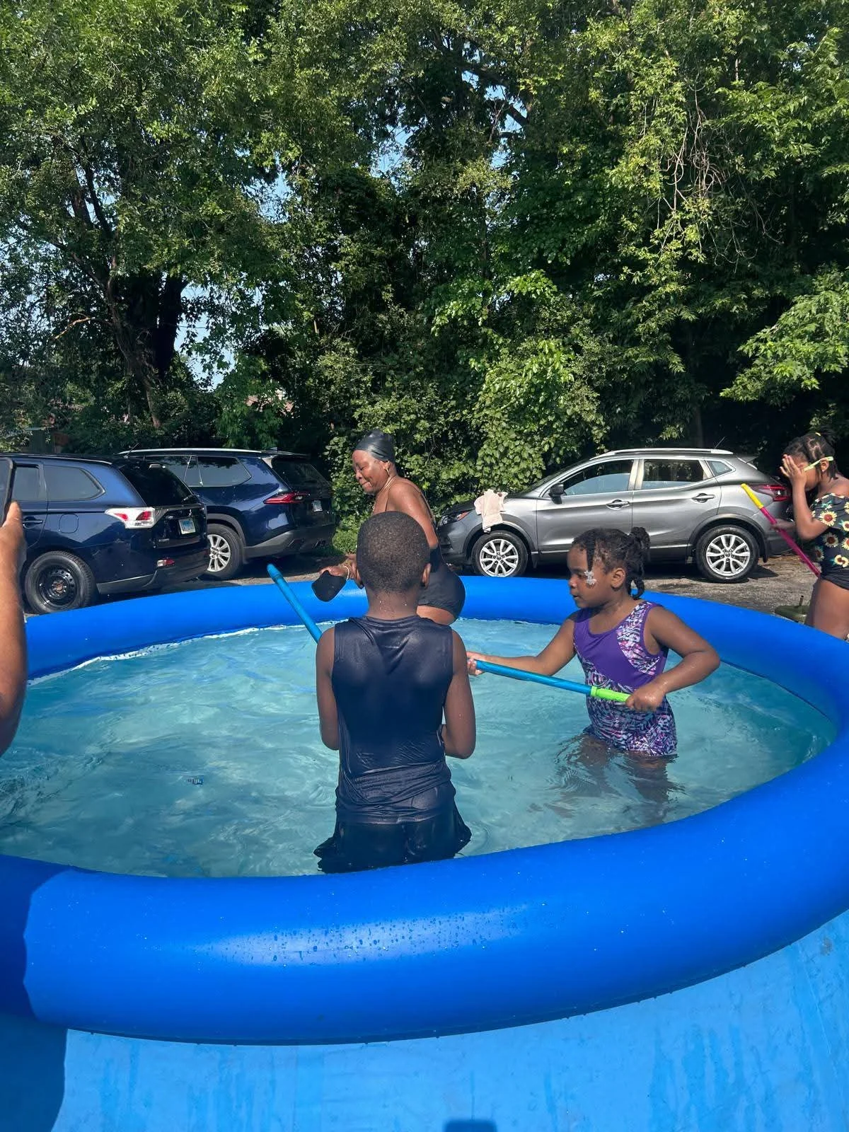 Children enjoying an outdoor pool activity